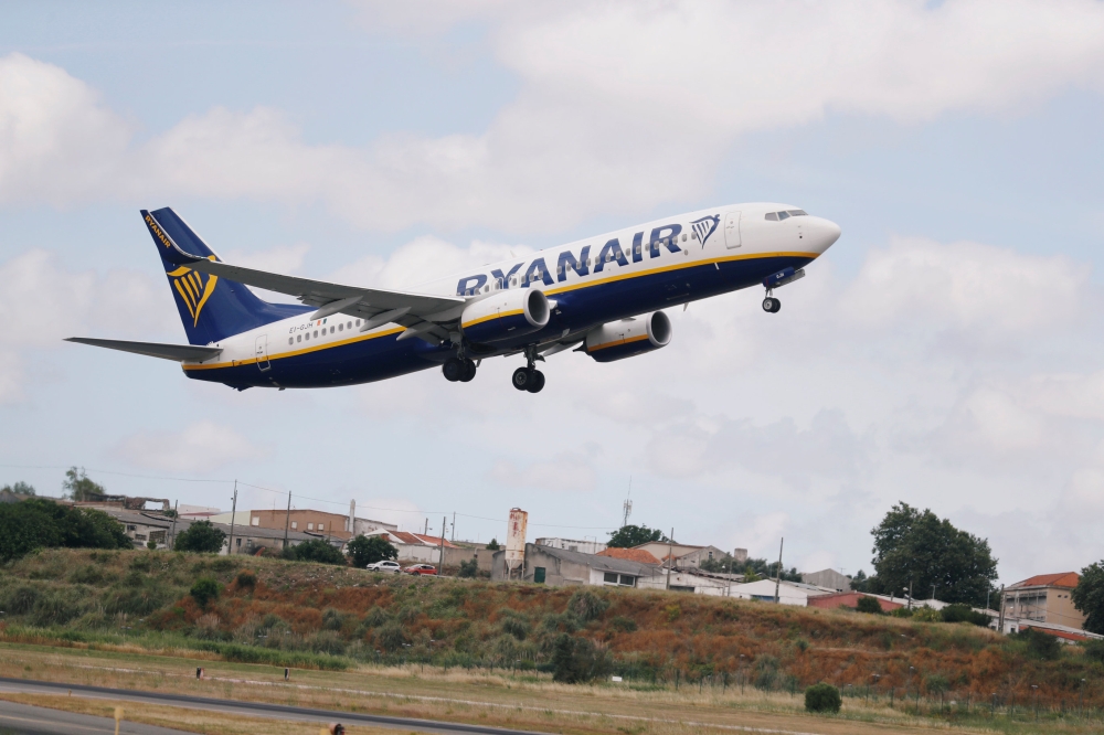 A Ryanair Boeing plane takes off at Lisbon's airport, Portugal. — Reuters