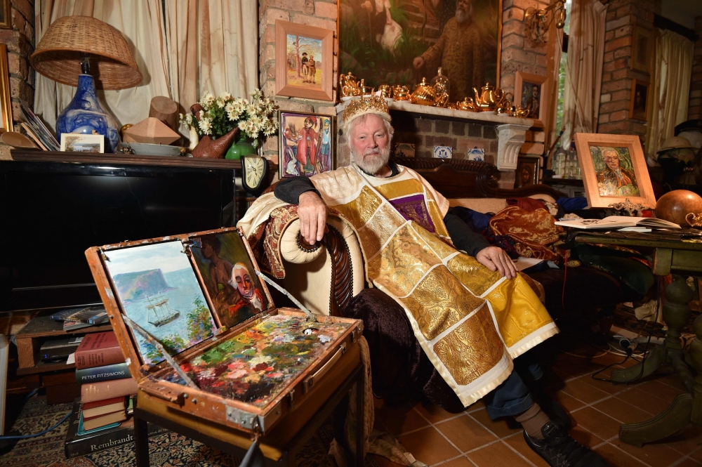 Paul Delprat, 76, poses for a photo in his home as the self-appointed Prince of the Principality of Wy, a micronation spanning his home in the north Sydney suburb of Mosman. Delprat's homemade kingdom, filled with monarchical and historical paraphernalia, is, like some micronations, born out of a dispute with authorities. - AFP