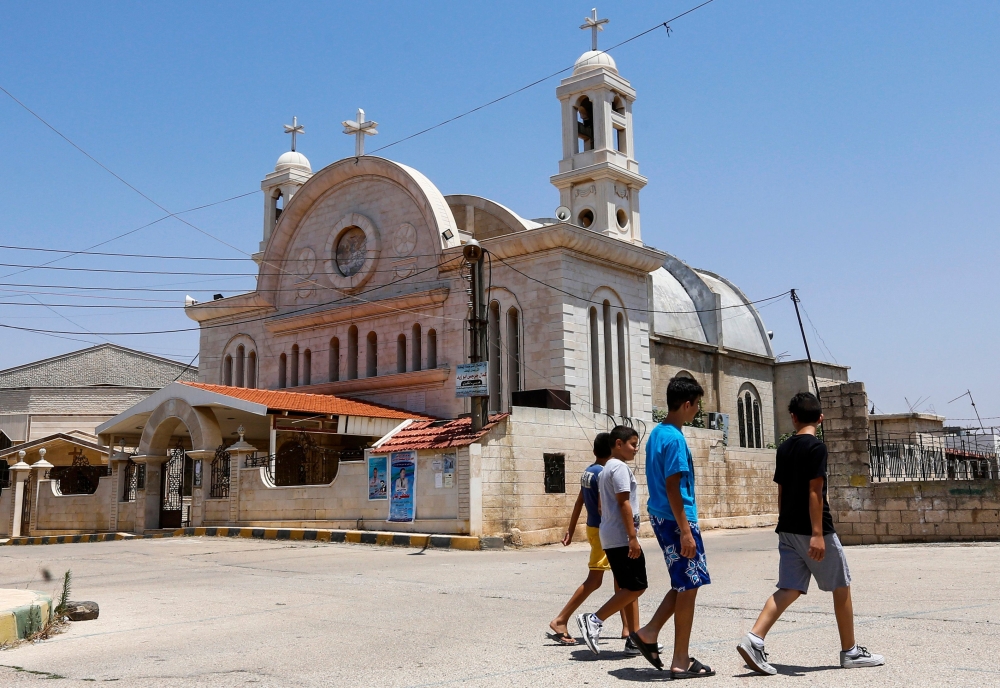 A view of the St. Elias Syriac Orthodox church in the Syrian Christian village of Fairouzah, southeast of the central city of Homs. Fairouzah, home to six churches and hundreds of Christians from the nearby ravaged city of Homs, remained relatively insulated from violence in Syria, but was too dangerous to reach. — AFP photos