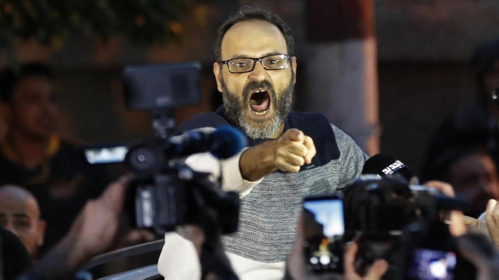 Ziad Itani, a Lebanese stage actor, who was indicted on charges of collaborating with Israel and drug possession, shouts as he speaks with journalists after he was released by Lebanese authorities, at his house, in Beirut in March. — Reuters