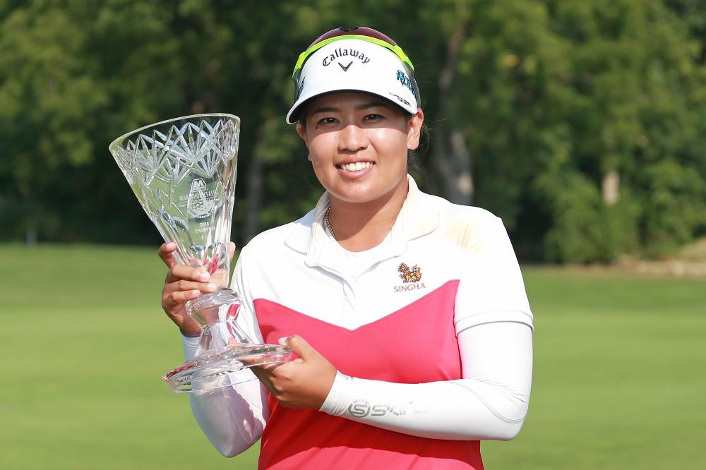 Thidapa Suwannapura of Thailand poses with the trophy after winning the Marathon Classic at Highland Meadows Golf Club in Sylvania, Ohio, Sunday. — AFP 