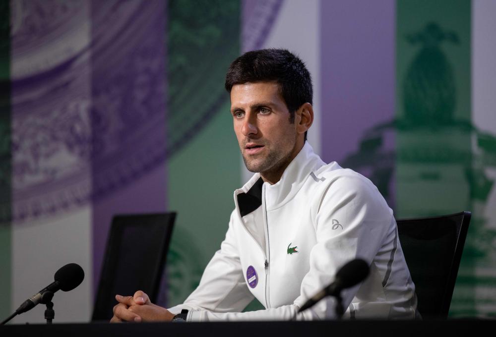 Serbia’s Novak Djokovic takes part in a press conference following his victory at the 2018 Wimbledon Championships Sunday. — AFP 