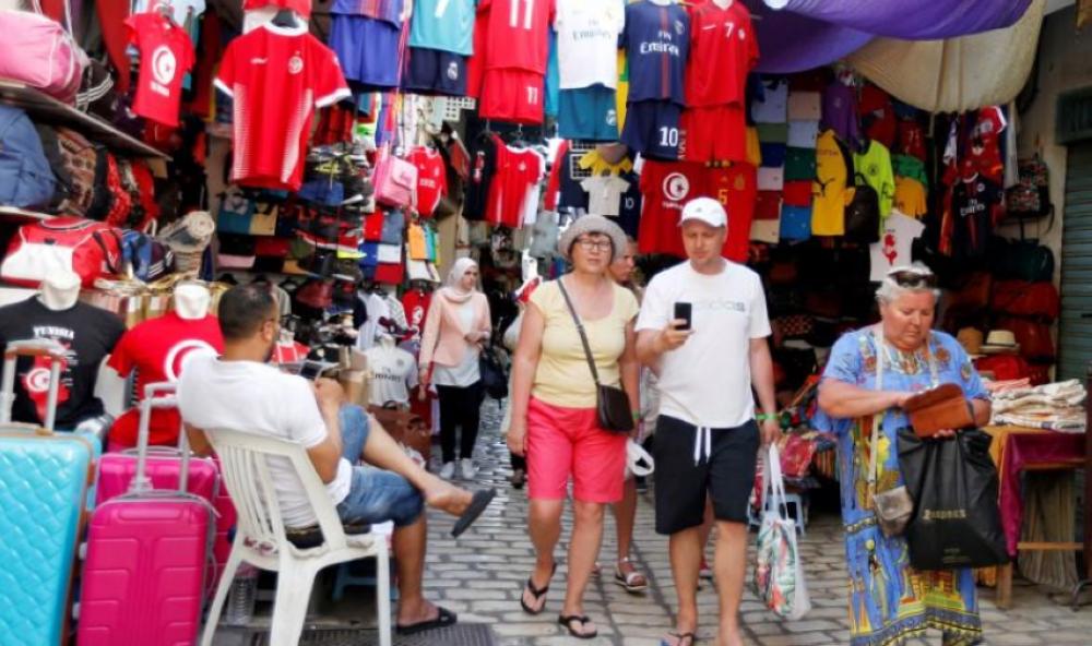 Russian tourists are seen shopping at the old medina in Sousse, Tunisia. — Reuters