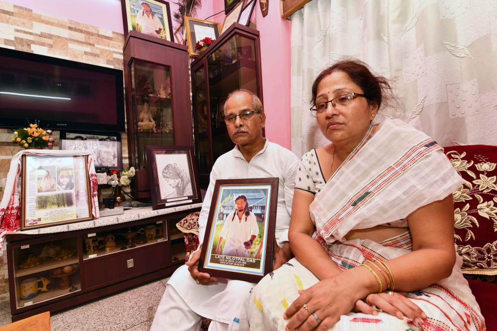 Gopal Chandra Das, left, and Radhika Das, right, parents of lynching victim Nilotpal Das, speak to journalists at their residence in Guwahati, the capital city of India’s northeastern state of Assam, in this July 9, 2018 file photo. — AFP