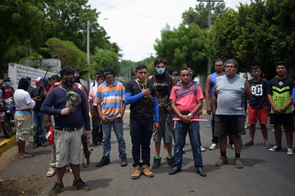 Friends and relatives attend the funeral of Jose Esteban Sevilla Medina, who was shot dead during clashes with riot police and paramilitaries at Monimbo neighborhood in Masaya, some 35 km from Managua, on Monday. — AFP