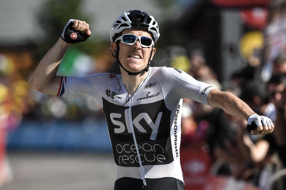 Great Britain's Geraint Thomas celebrates as he crosses the finish line to win the eleventh stage of the 105th edition of the Tour de France cycling race between Albertville and La Rosiere, French Alps, Wednesday. — AFP 