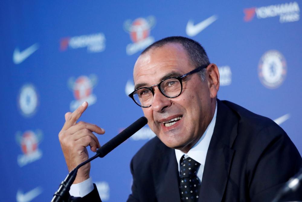 Chelsea’s newly appointed manager Maurizio Sarri speaks during his unveiling press conference at Stamford Bridge in west London Wednesday. — AFP