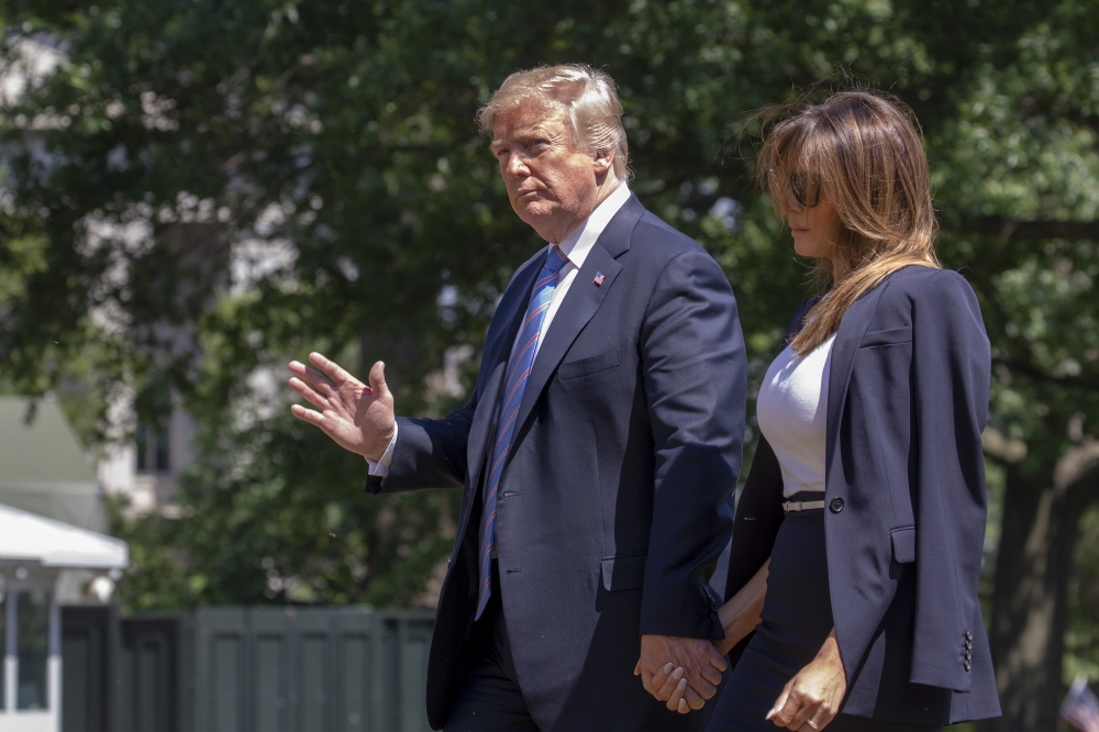 US President Donald Trump and First Lady Melania Trump return to the White House in Washington, from Joint Base Andrews in Maryland, on Wednesday. — AFP