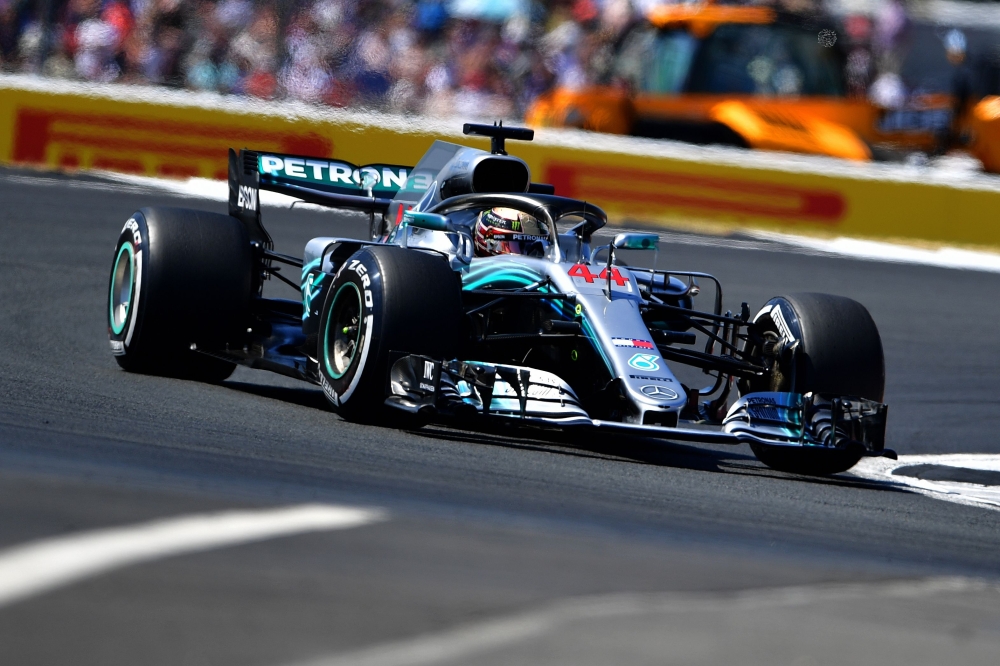 File photo shows Mercedes' British driver Lewis Hamilton driving during the qualifying session at Silverstone motor racing circuit in Silverstone, central England, ahead of the British Formula One Grand Prix. Hamilton signed a two-year contract extension with Mercedes, his team said Thursday. — AFP