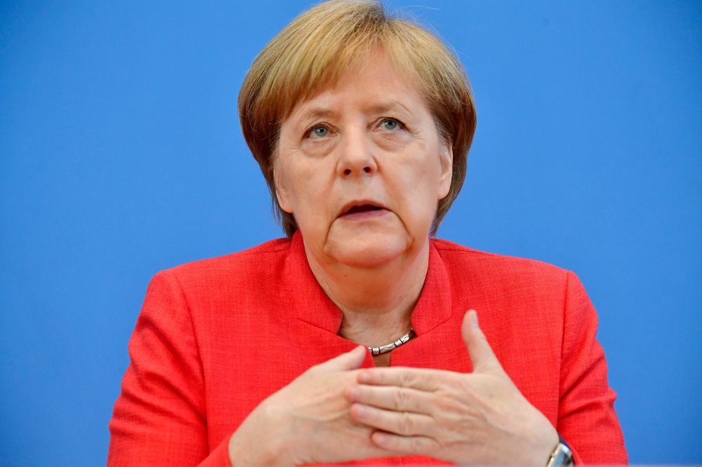 German Chancellor Angela Merkel attends her summer press conference in Berlin, on Friday. — AFP