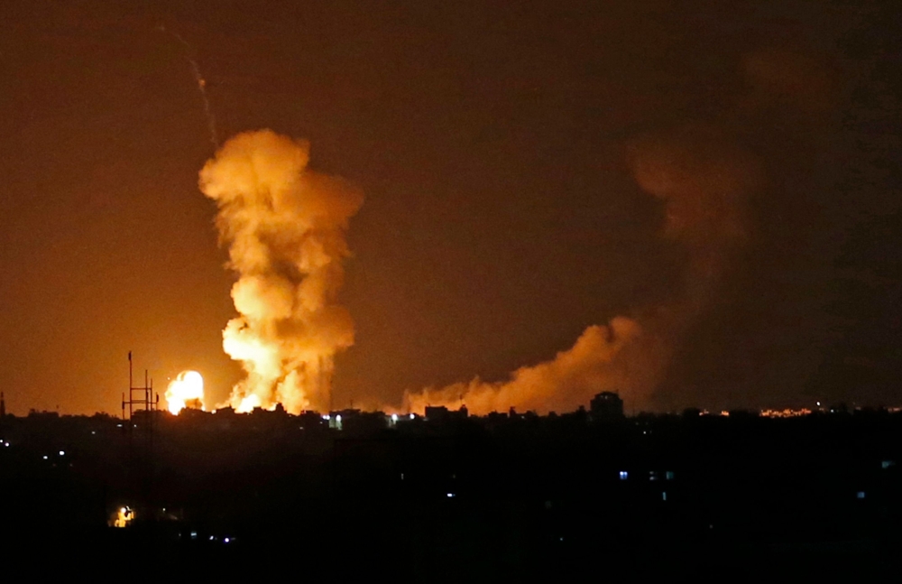A picture taken on Friday shows explosions from Israeli bombardment in Khan Yunis in the southern Gaza Strip.  — AFP