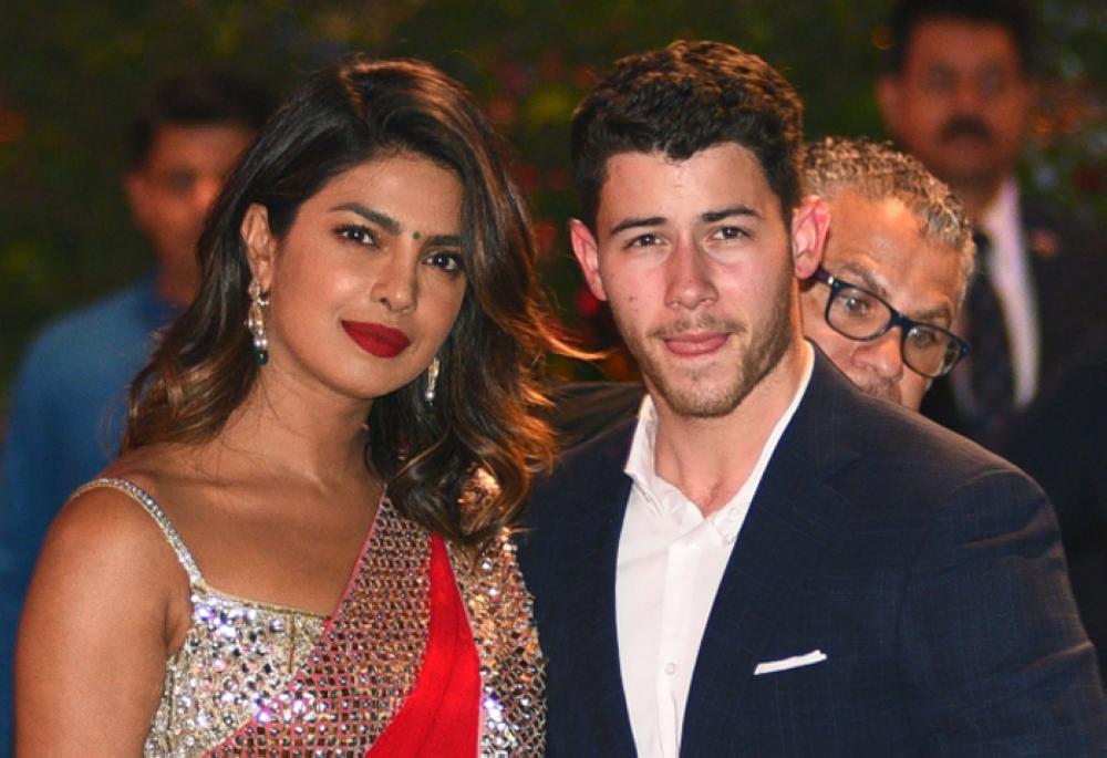 Indian Bollywood actress Priyanka Chopra, left, and US singer Nick Jonas stand together in Mumbai in this June 28, 2018 file photo. — AFP