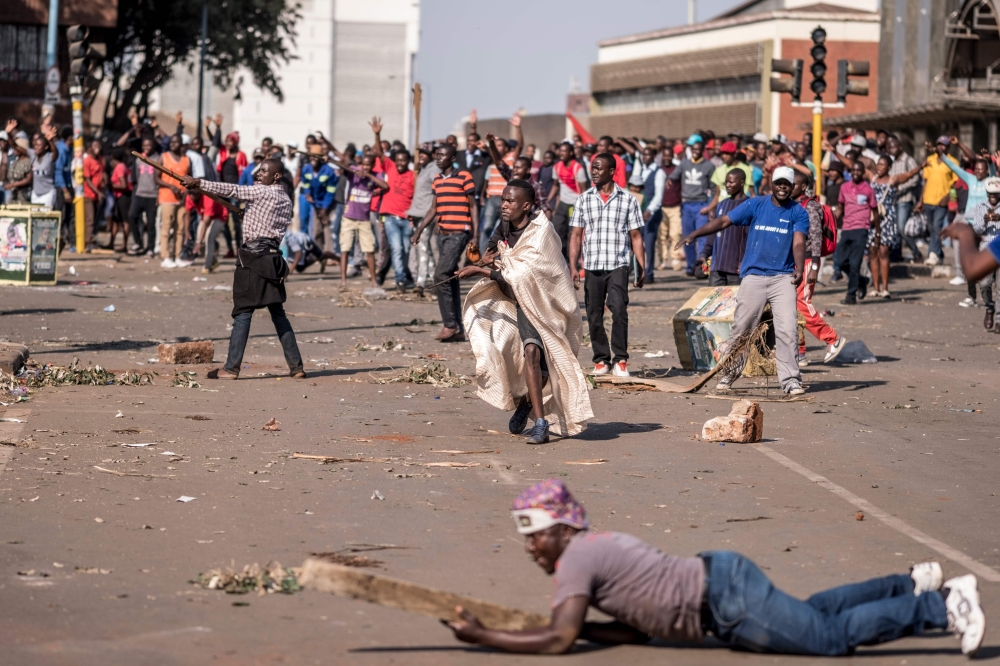 Supporters of Zimbabwe’s MDC party demonstrate outside ZANU PF headquarters in Harare on Wednesday, as protests erupted over alleged fraud in the country’s election. — AFP