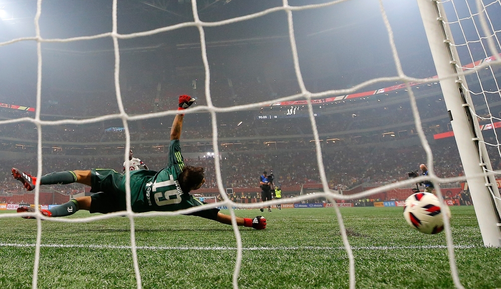 Goalkeeper Mattia Perin No. 19 of Juventus dives as the penalty kick by Bradley Wright-Phillips No. 99 of the MLS All-Stars hits the post during the 2018 MLS All-Star Game at Mercedes-Benz Stadium on Wednesday in Atlanta, Georgia. — AFP