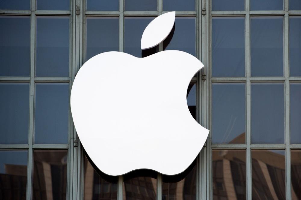 In this file photo the Apple logo is seen on the outside of Bill Graham Civic Auditorium in San Francisco, California. Apple became the first private company to surpass $1 trillion in stock market value Thursday following its latest surge after reporting strong quarterly earnings. Shares of Apple briefly hit $207.05 in late-morning trading, before retreating somewhat. The gains came after the iPhone maker reported strong earnings late Tuesday that prompted a two-day rally in the share price. — AFP