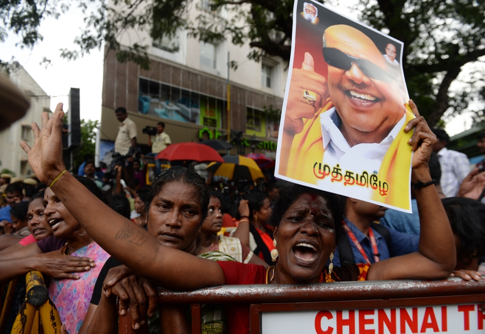 Dravida Munnetra Kazhagam (DMK) party supporter reacts in front of hospital where party president M. Karunanidhi died, in Chennai on Tuesday. Thousands of people descended into mourning in southern India after the death of revered 94-year-old political leader Muthuvel Karunanidhi. — AFP