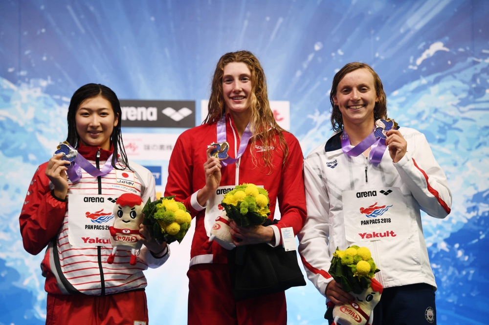 (From L) Japan's swimmer Rikako Ikee, Canada's swimmer Taylor Ruck and US swimmer Katie Ledecky pose on the podium of the 200m freestyle women final of the Pan Pacific Swimming Championships 2018 in Tokyo, on Thursday. — AFP