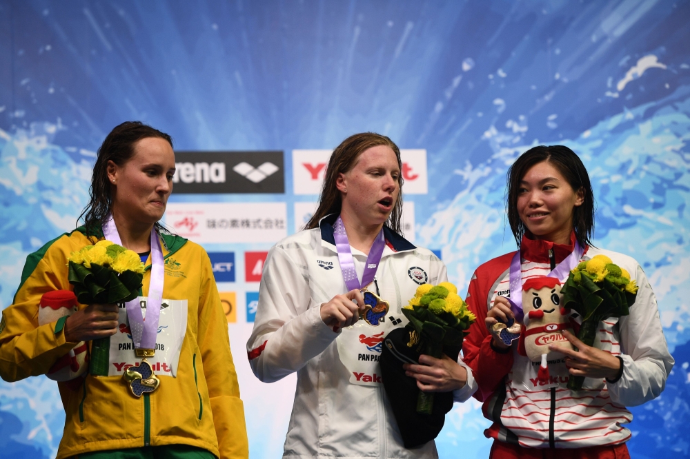 (From L) Japan's swimmer Rikako Ikee, Canada's swimmer Taylor Ruck and US swimmer Katie Ledecky pose on the podium of the 200m freestyle women final of the Pan Pacific Swimming Championships 2018 in Tokyo, on Thursday. — AFP