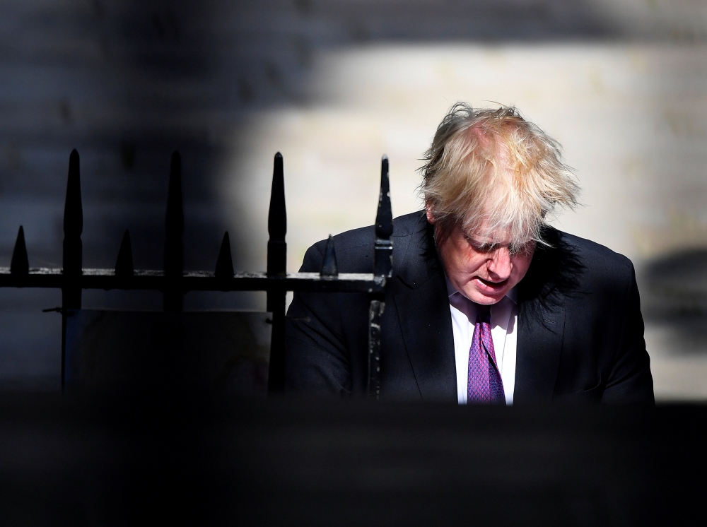 Former Britain’s Foreign Secretary Boris Johnson walks to Downing Street in London in this June 26, 2018 file photo. — Reuters