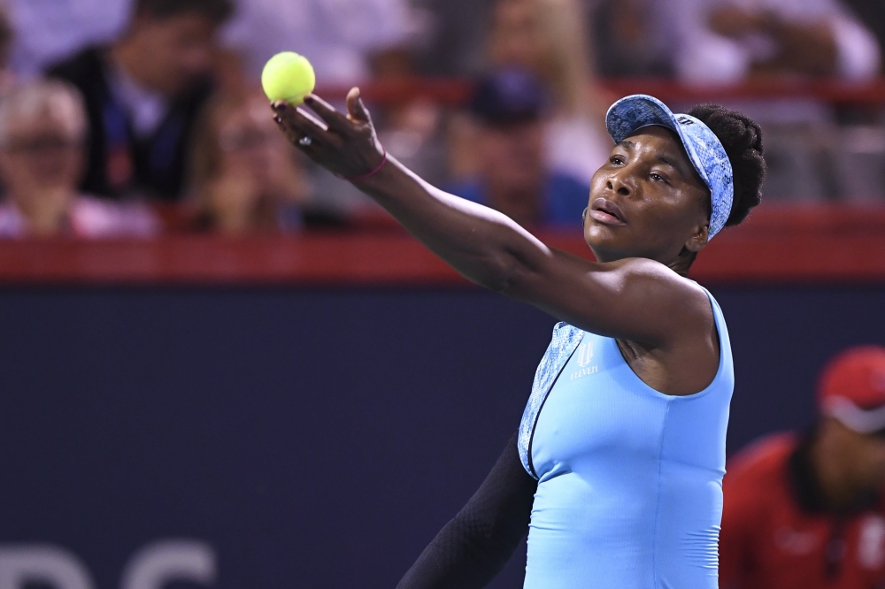 Venus Williams serves against Simona Halep of Romania during day four of the Rogers Cup at IGA Stadium on Thursday in Montreal, Quebec, Canada. — AFP