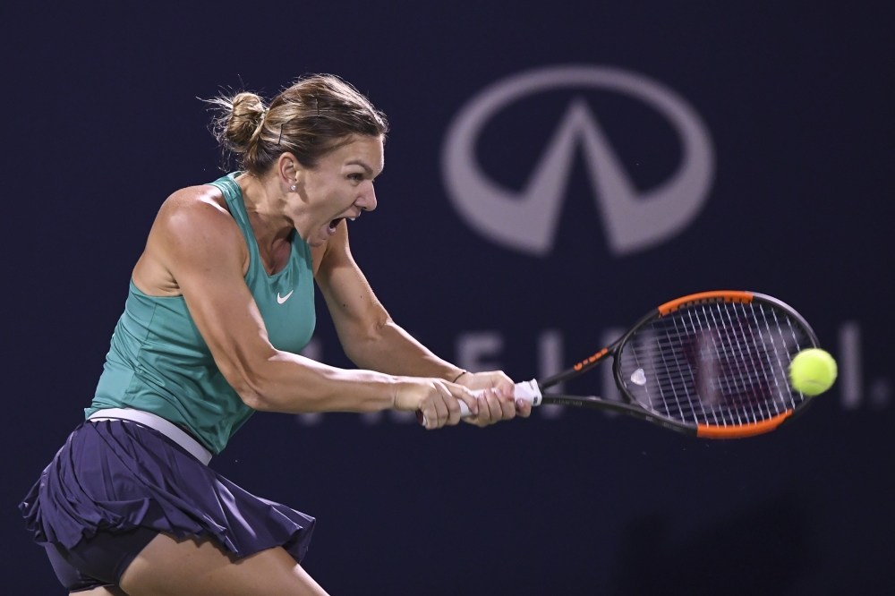 Venus Williams serves against Simona Halep of Romania during day four of the Rogers Cup at IGA Stadium on Thursday in Montreal, Quebec, Canada. — AFP