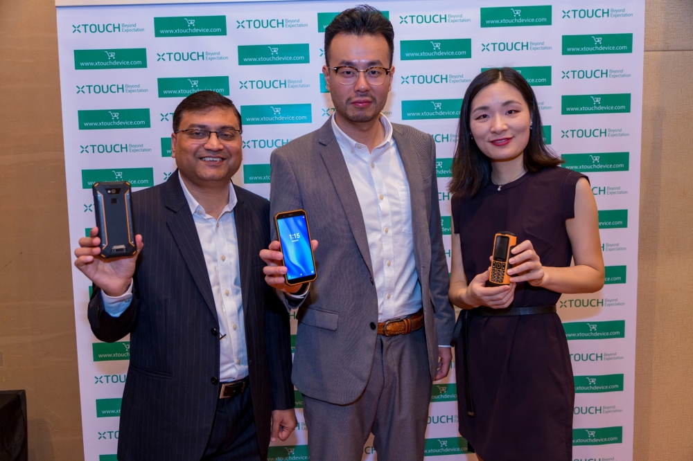 Sandeep Agarwal, Executive Director; Tim Chen, Founder & Managing Director and Icey Bin, Marketing Director XTouch show off the new products