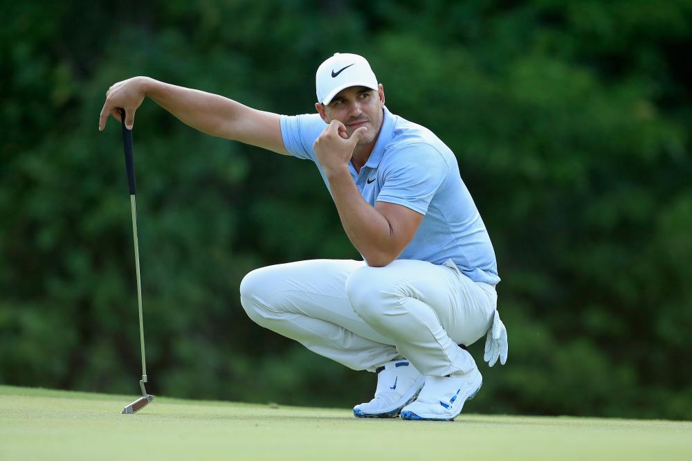 Brooks Koepka of the US lines up a putt on the 17th green during the third round of the 2018 PGA Championship at Bellerive Country Club in St Louis, Missouri, Saturday. — AFP