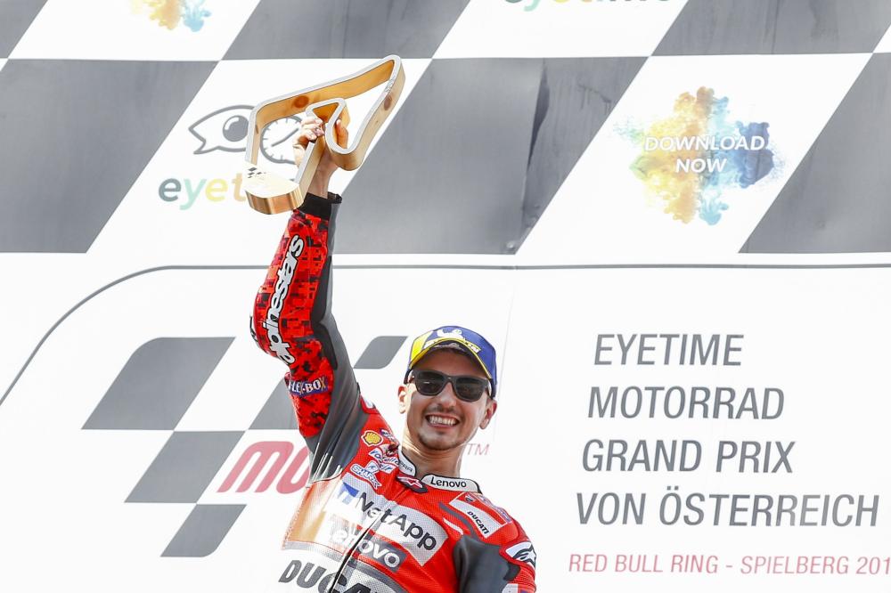 Ducati Team’s Spanish rider Jorge Lorenzo celebrates with the trophy on the podium of the Austrian MotoGP Grand Prix at the Red Bull Ring in Spielberg, Austria, Sunday. — AFP 