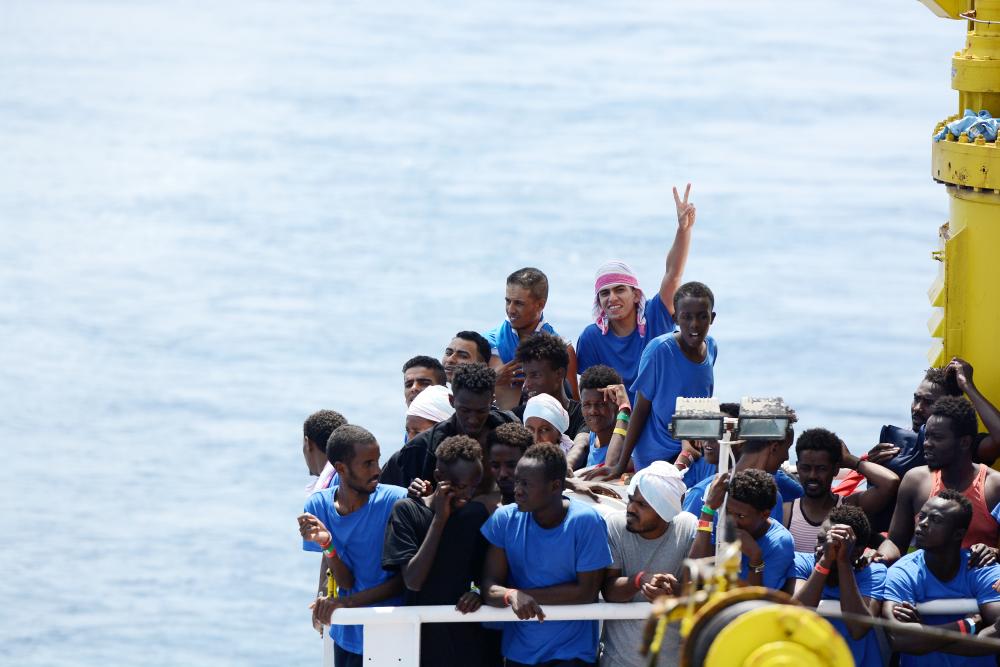 Migrants are seen on board the MV Aquarius rescue ship run by SOS Mediterranee organisation and Doctors Without Borders during a search and rescue (SAR) operation in the Mediterranean Sea, off the Libyan Coast, on Sunday. — Reuters