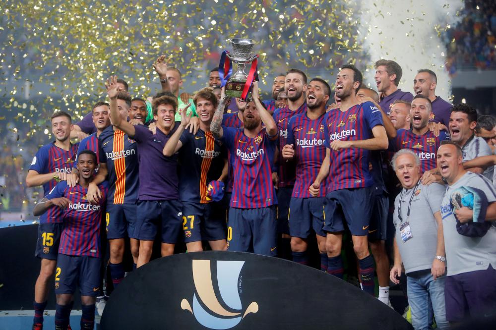 Barcelona’s Lionel Messi lifts Spanish Super Cup after beating Sevilla at Grand Stade de Tanger, Tangier, Morocco, Sunday. — Reuters