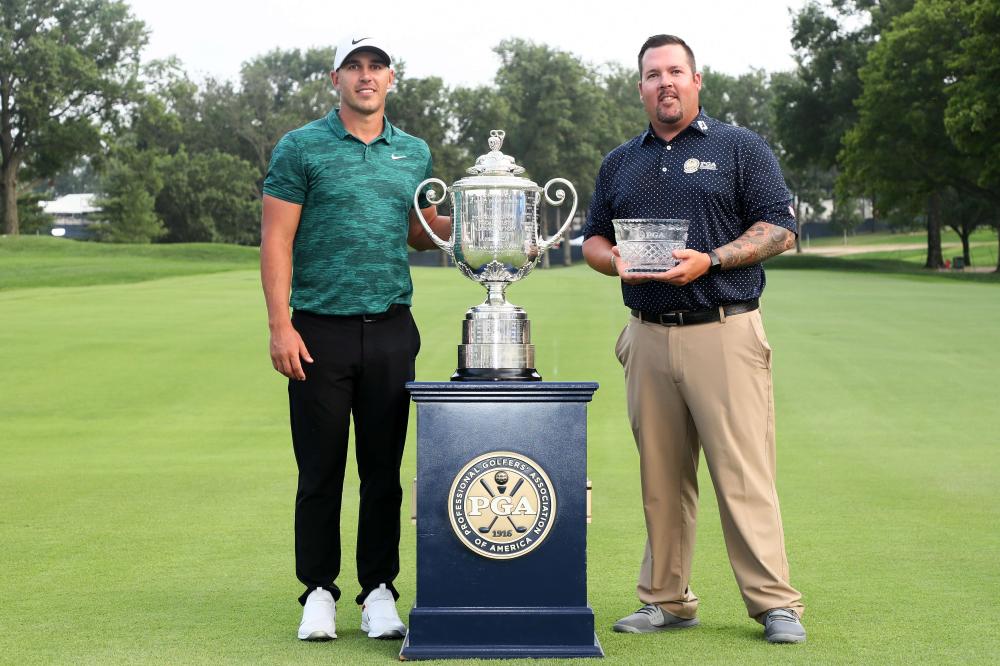 Brooks Koepka of the US poses with Club Professional Ben Kern and the Wanamaker Trophy after winning the 2018 PGA Championship at Bellerive Country Club in St Louis, Missouri, Sunday. — AFP