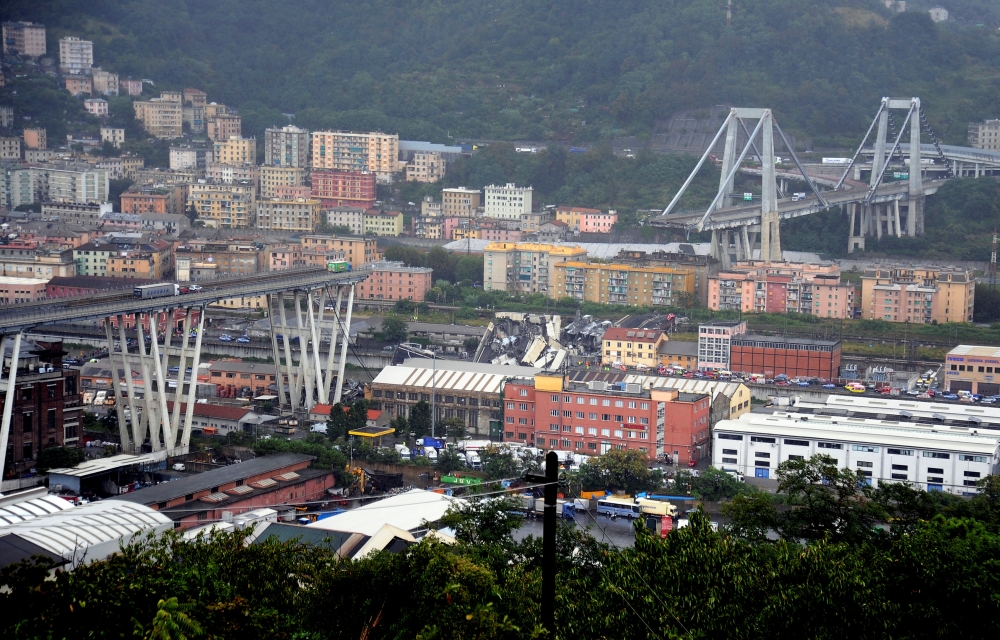 The collapsed Morandi Bridge is seen in the Italian port city of Genoa on Tuesday. — Reuters