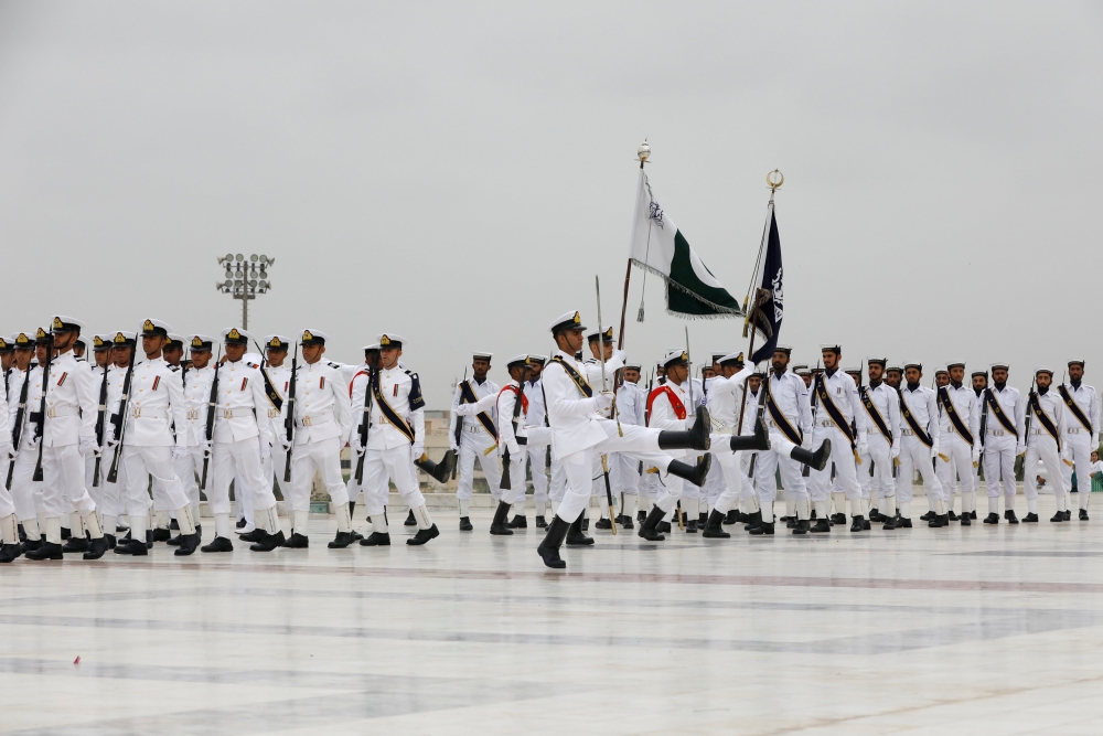 Members of the Pakistan’s Naval force march  during a ceremony to celebrate the country’s 71st Independence Day at the mausoleum of Muhammad Ali Jinnah in Karachi, Pakistan, on Tuesday. — Reuters