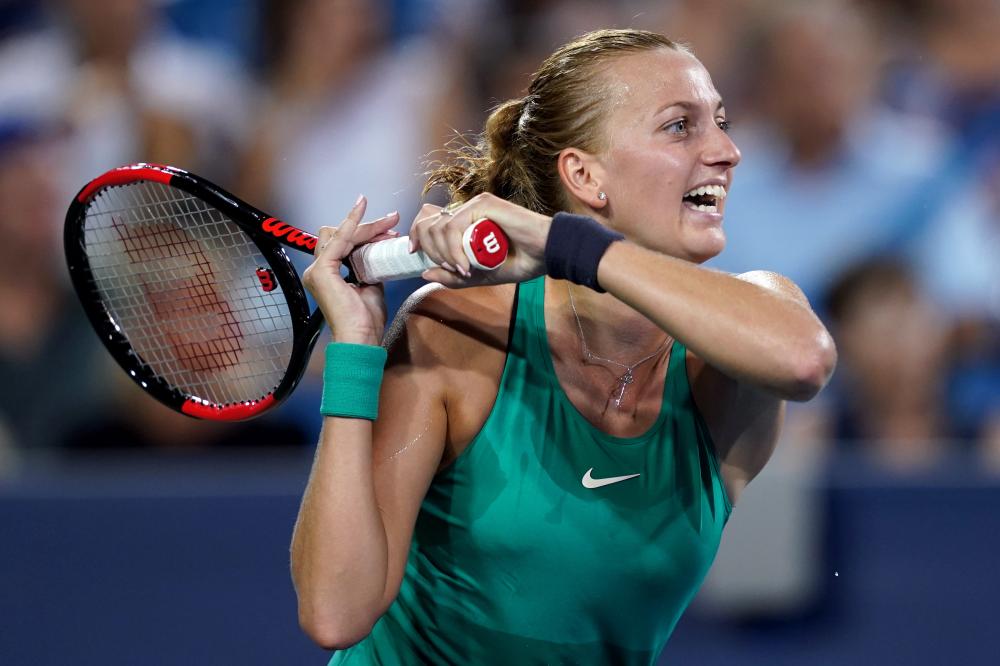 Petra Kvitova returns a shot to Serena Williams in the Western and Southern Tennis Open at Lindner Family Tennis Center in Cincinnati Tuesday. — Reuters