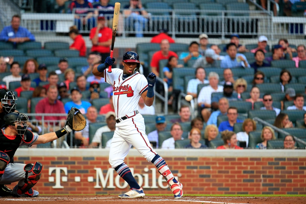 Ronald Acuna Jr. No. 13 of the Atlanta Braves is hit by the first pitch of the game against the Miami Marlins at SunTrust Park on Wednesday in Atlanta, Georgia. — AFP
