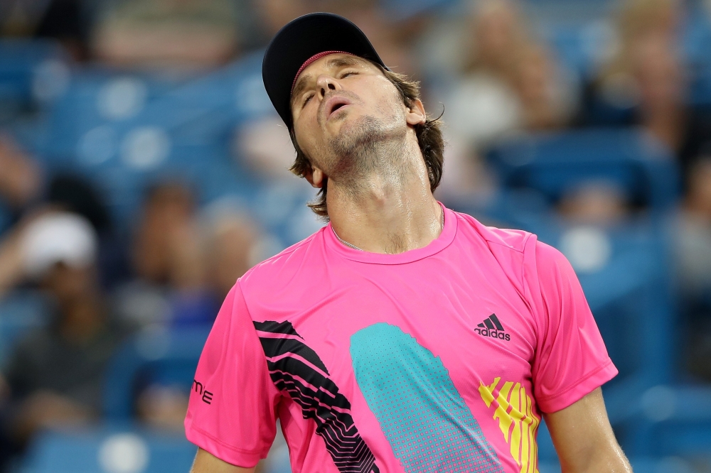 Mischa Zverev of Germany reacts to a lost point while playing Grigor Dimitrov of Bulgaria during the Western & Southern Open at Lindner Family Tennis Center on Wednesday in Mason, Ohio. — AFP