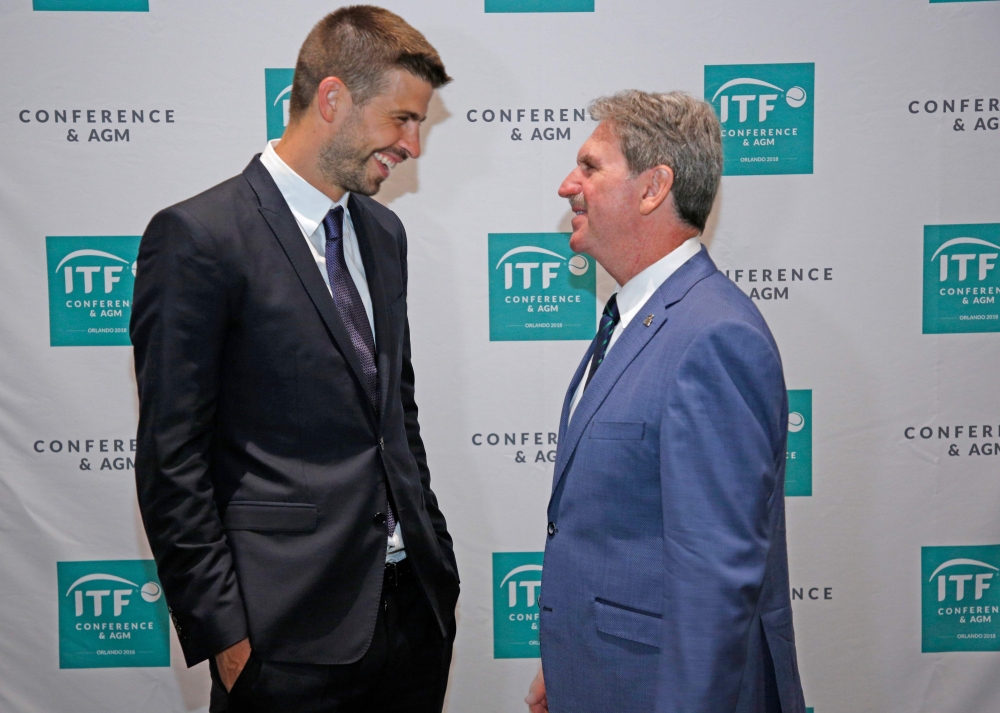 David Haggerty (R), President of the International Tennis Federation, speaks with Gerard Pique, Founder of Kosmos sports group during the ITF annual general meeting in Orlando, Florida on Thursday. World tennis chiefs on approved a radical Davis Cup revamp that will overhaul the 118-year-old competition, condensing the annual worldwide showpiece into an 18-team, week-long event. — AFP