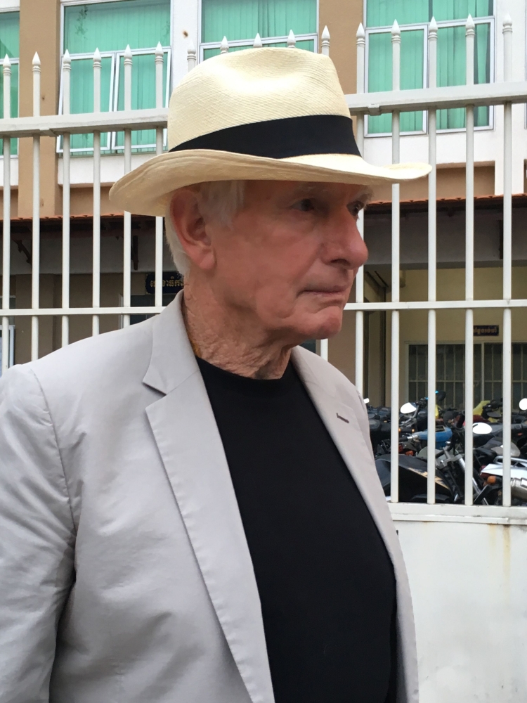 Hollywood director Peter Weir leaves the court in Phnom Penh after testifying in the trial of detained Australian filmmaker James Ricketson on Thursday. — AFP