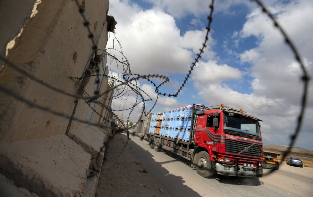 A truck carrying goods arrives at Kerem Shalom crossing in Rafah in the southern Gaza Strip on Wednesday. — Reuters