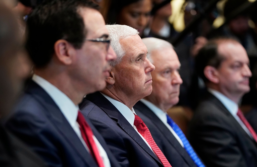 From left: US Treasury Secretary Steven Mnuchin, Vice President Mike Pence, Attorney General Jeff Sessions, and Labor Secretary Alex Acosta take part in a Cabinet meeting in the Cabinet Room of the White House in Washington on Thursday. — AFP