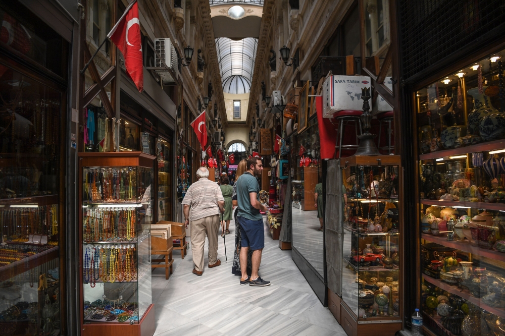People shop the gallery Europe passage on Thursday near the Istiklal avenue, at Beyoglu district, in Istanbul. — AFP