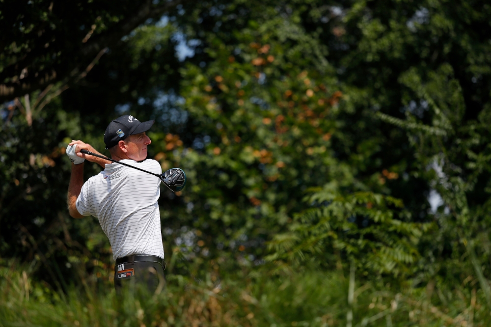 Jim Furyk plays his tee shot on the 13th hole during the first round of the Wyndham Championship at Sedgefield Country Club on Thursday in Greensboro, North Carolina. — AFP
