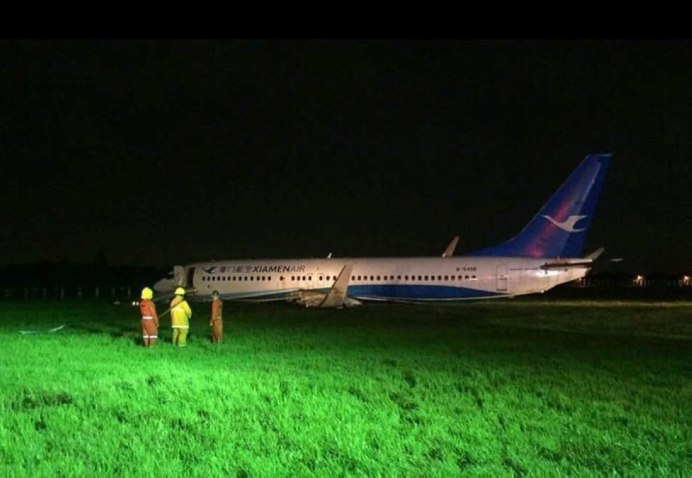 Stranded passengers wait at Terminal 1 for their flights to resume after Xiamen Airlines Boeing 737-800 Flight MF8667 overshot the runway upon landing at Ninoy Aquino International airport in Paranaque, Metro Manila in Philippines, on Friday. — Reuters