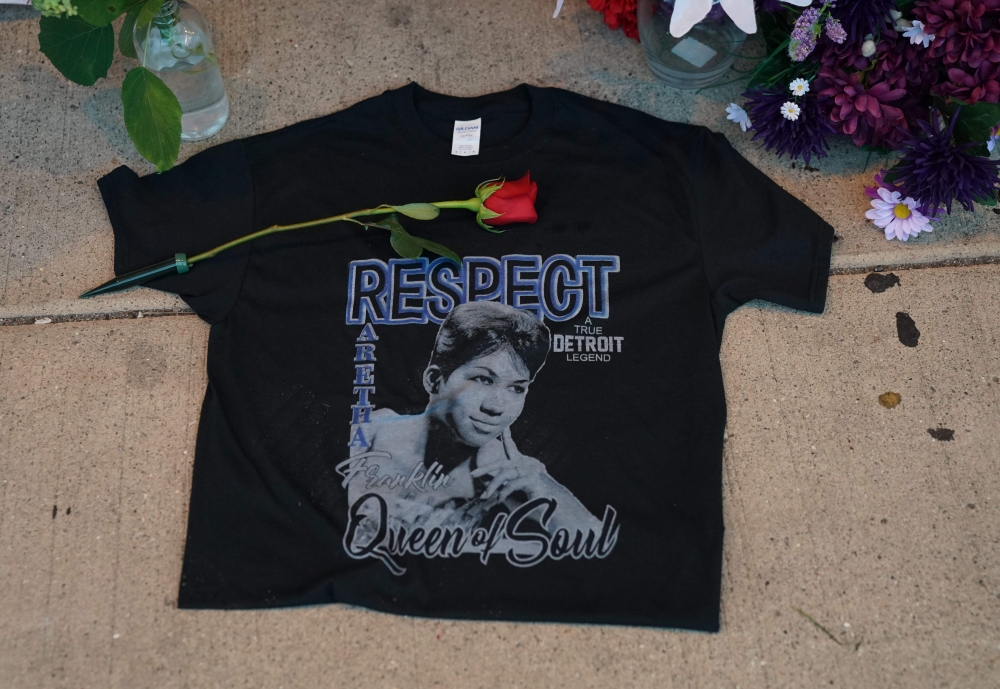 A rose is placed on a T-shirt at a temporary memorial set up for late singer Aretha Franklin at New Bethel Baptist Church in Detroit, Michigan, on Thursday. — AFP
