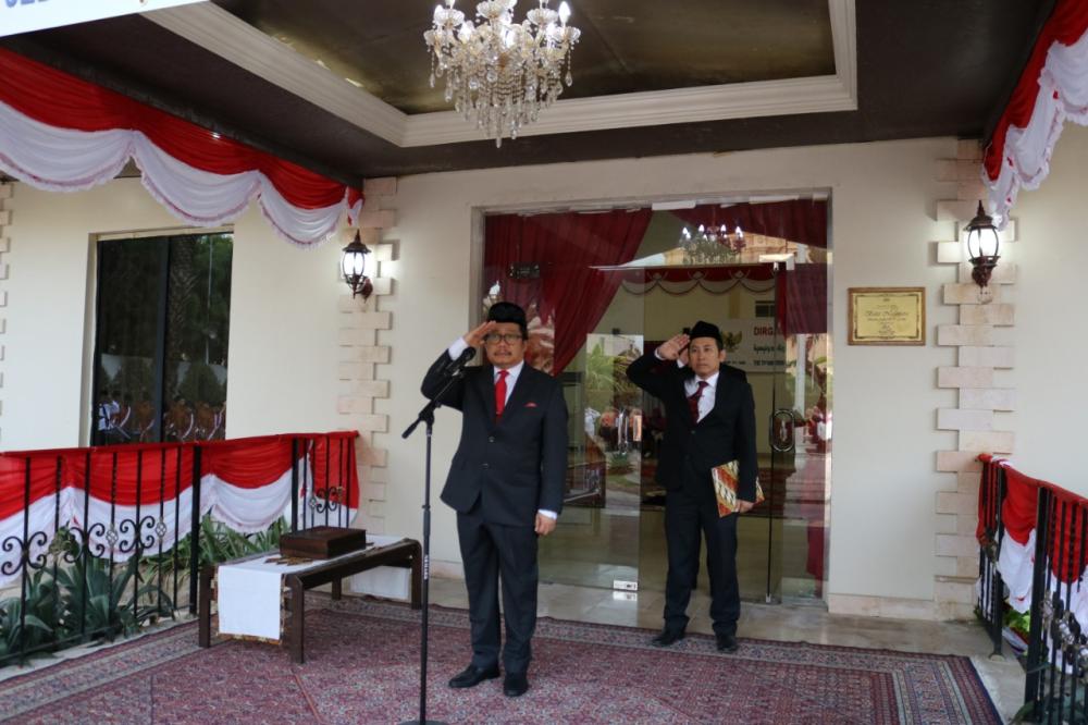 Indonesian Consul General Mohamad Hery Saripudin salutes the red and white national flag during the ceremony. — Courtesy photos