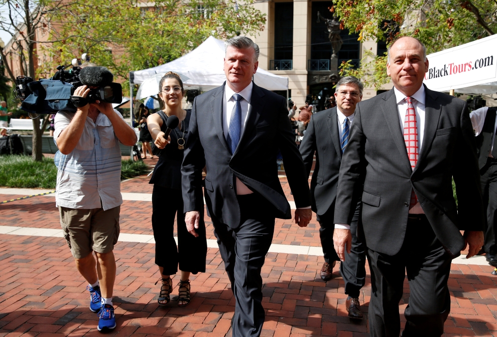 Defense attorneys Kevin Downing, Richard Westling and and Thomas Zehnle walk from the Federal Courthouse during the second day of jury deliberations in the trial against Paul Manafort, President Trump’s former campaign chairman who is facing bank and tax fraud charges in Alexandria, Virginia, on Friday. — Reuters