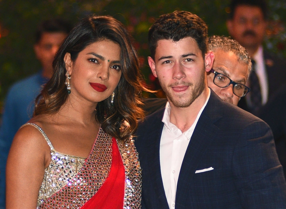 Bollywood actress Priyanka Chopra, left, accompanied by Nick Jonas arrive for the pre-engagement party of India’s richest man Mukesh Ambani’s eldest son Akash Ambani and fiancee Shloka Mehta in Mumbai in this June 28, 2018 file photo. — AFP