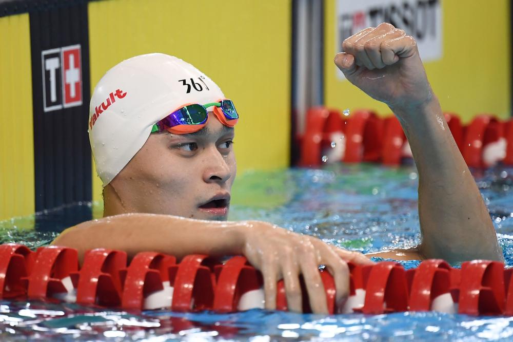 China's Sun Yang celebrates after winning the men's 200m freestyle during the 2018 Asian Games in Jakarta Sunday. — AFP