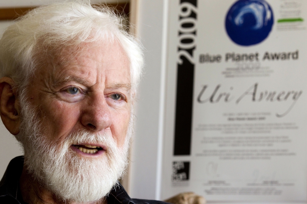 Uri Avnery, Israeli writer and founder of the Gush Shalom peace movement, speaks during a interview at his home in the coastal city of Tel Aviv in this July 26, 2011 file photo. — AFP