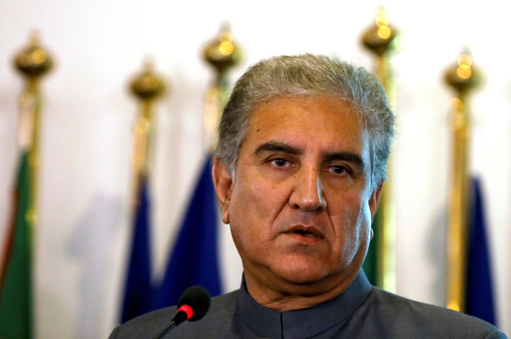 Pakistan’s new Foreign Minister Shah Mehmood Qureshi listens during a news conference at the Foreign Ministry in Islamabad on Monday. — Reuters